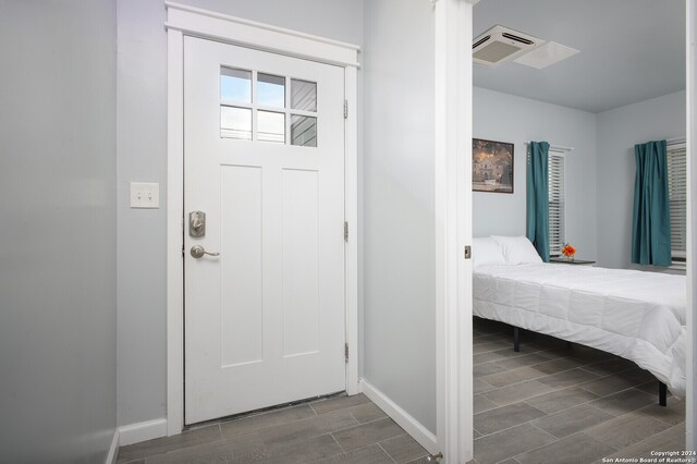 foyer with dark hardwood / wood-style floors