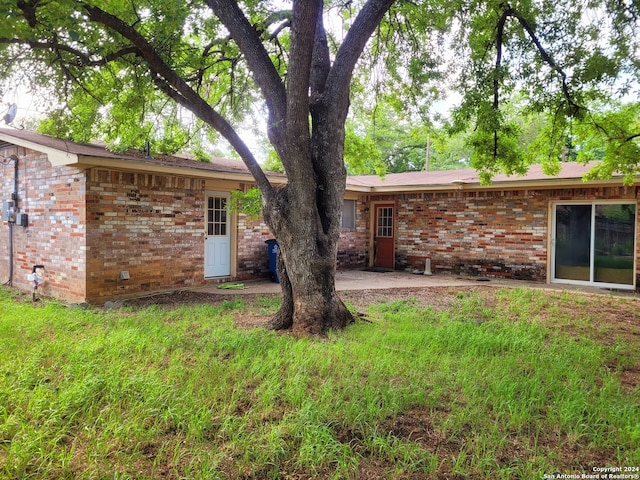 rear view of house featuring a patio area