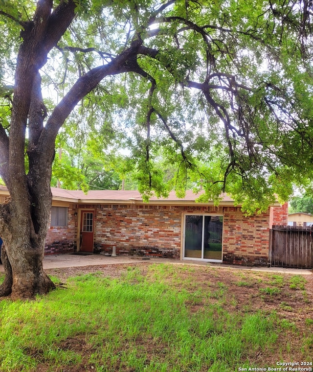 rear view of house featuring a patio area