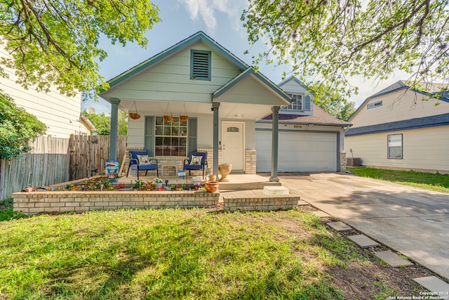 view of front of home with a garage and a porch