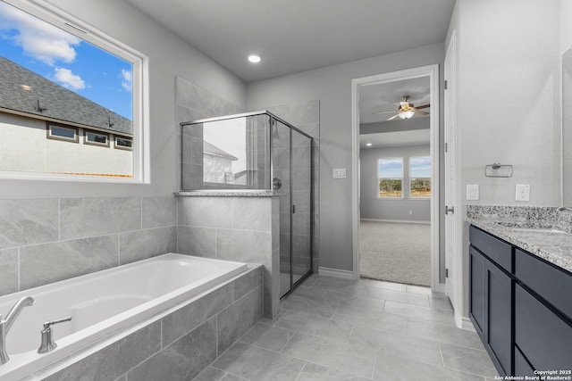 bathroom featuring ceiling fan, vanity, tile patterned floors, and plus walk in shower