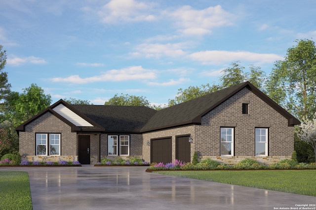 view of front of property featuring a front lawn and a garage