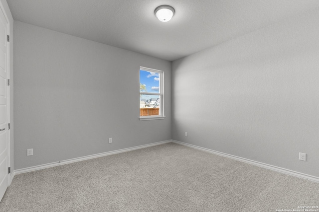 unfurnished room with carpet flooring