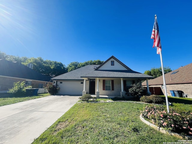 view of front of house with a front lawn and a garage