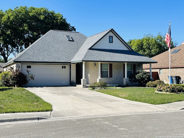 view of front of property featuring a garage and a front yard