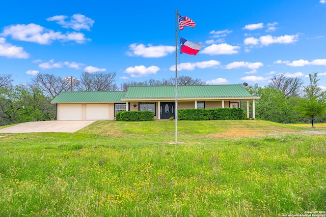 ranch-style house with a garage and a front yard