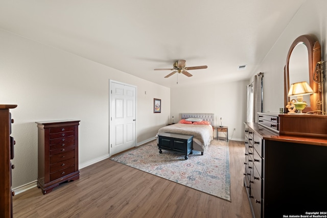 bedroom featuring wood-type flooring and ceiling fan