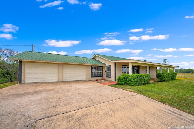 ranch-style house with a front yard and a garage