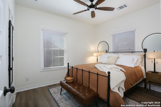 bedroom featuring ceiling fan and dark hardwood / wood-style floors