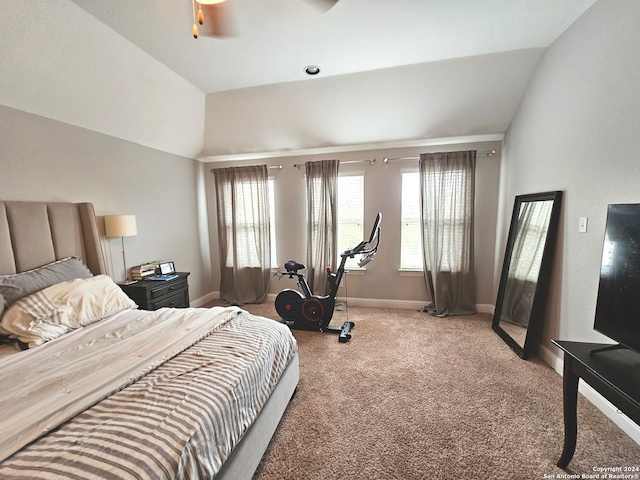 carpeted bedroom with vaulted ceiling and ceiling fan