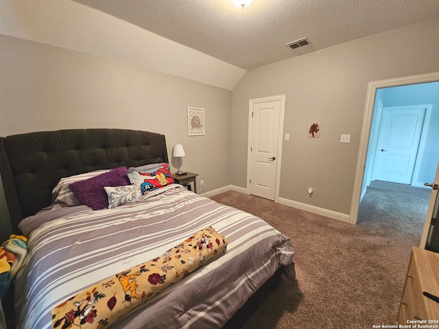 carpeted bedroom featuring lofted ceiling and a textured ceiling