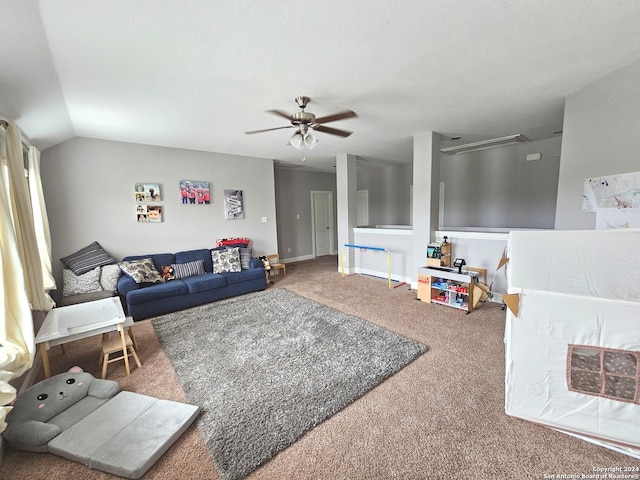 living room with vaulted ceiling, carpet floors, and ceiling fan