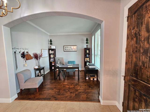 tiled dining area with an inviting chandelier and ornamental molding