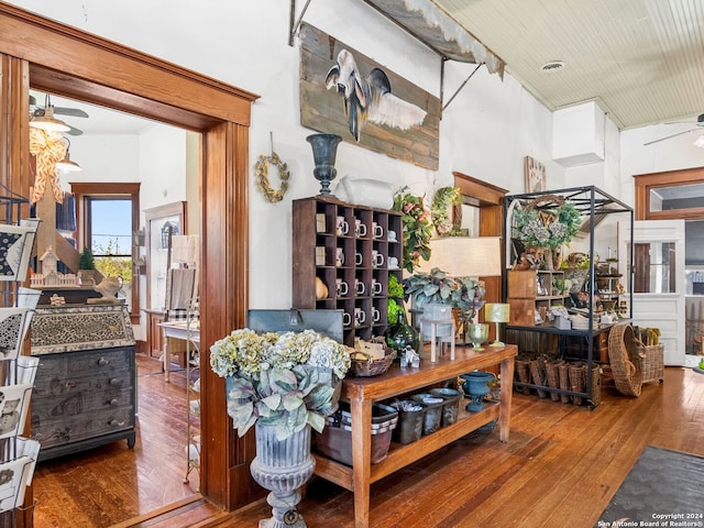 living room featuring high vaulted ceiling, wood-type flooring, and ceiling fan