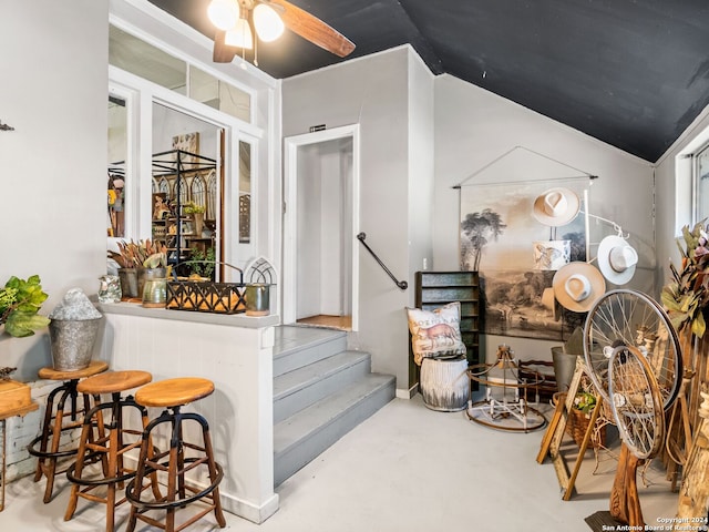 interior space featuring vaulted ceiling and ceiling fan