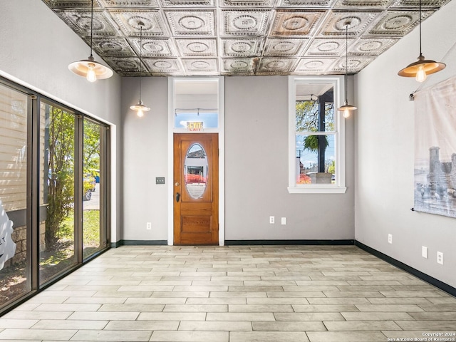 foyer entrance with a towering ceiling