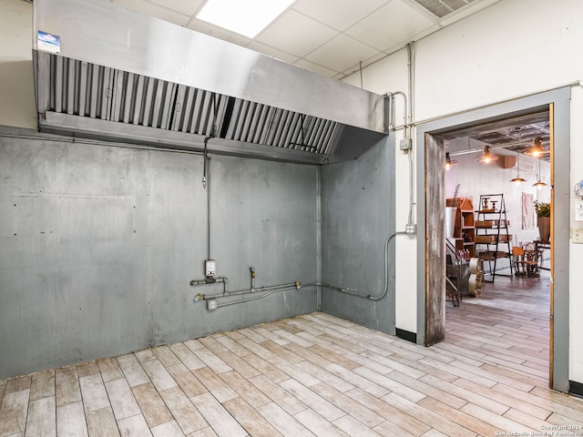 basement with light hardwood / wood-style flooring