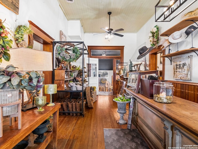 living room with hardwood / wood-style floors and ceiling fan