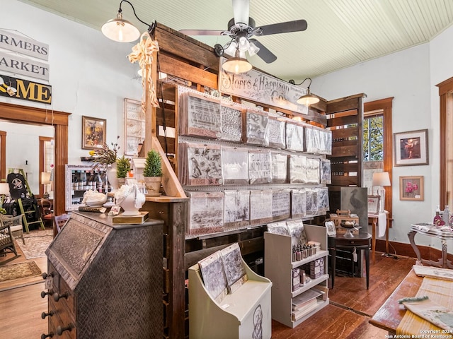 interior space with ceiling fan and hardwood / wood-style flooring