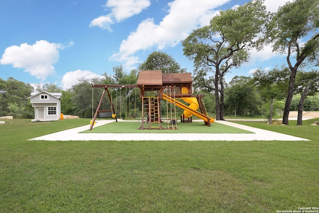 view of playground with a lawn