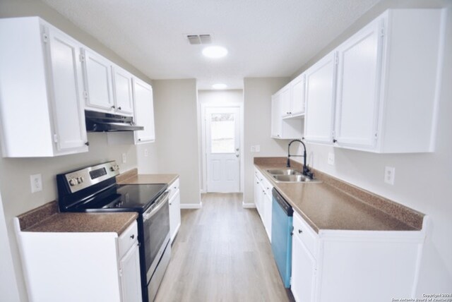 kitchen with light hardwood / wood-style flooring, stainless steel appliances, white cabinetry, and sink