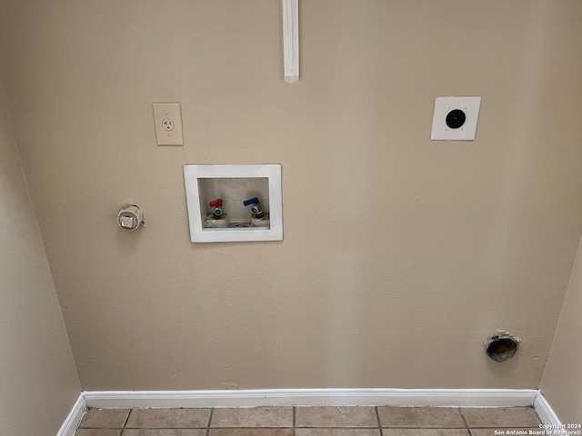 washroom featuring hookup for an electric dryer, tile flooring, and hookup for a washing machine