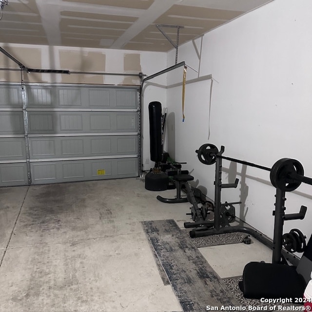 workout room featuring concrete floors