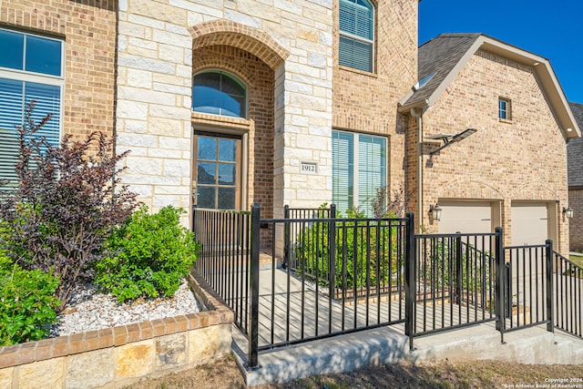 entrance to property featuring a garage