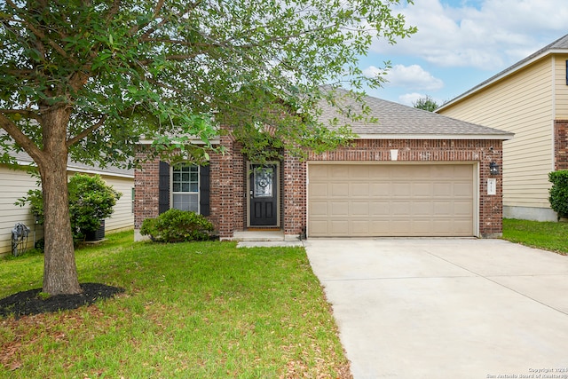 view of front of property with a garage and a front yard