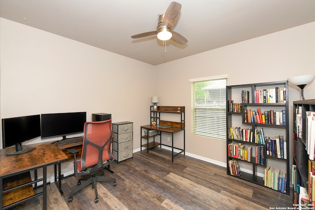 office with dark hardwood / wood-style floors and ceiling fan