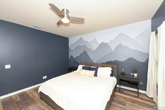 bedroom featuring dark wood-type flooring and ceiling fan