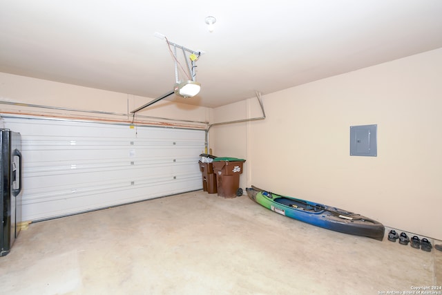 garage with fridge and a garage door opener