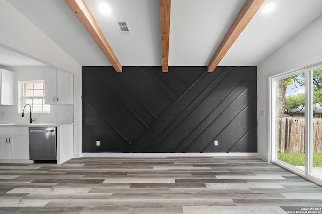 interior space with plenty of natural light and light hardwood / wood-style flooring