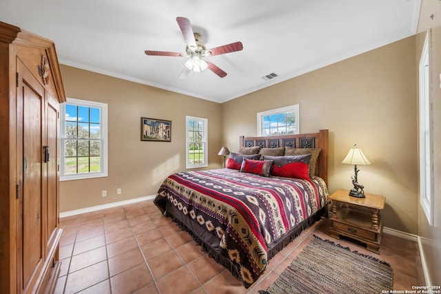 bedroom with ornamental molding, ceiling fan, tile floors, and multiple windows