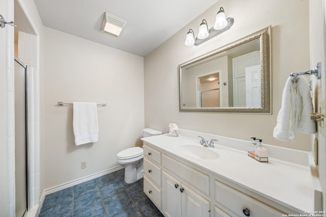 bathroom featuring tile flooring, toilet, and large vanity