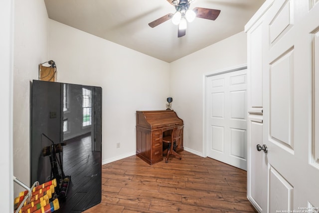 miscellaneous room featuring dark wood-type flooring and ceiling fan