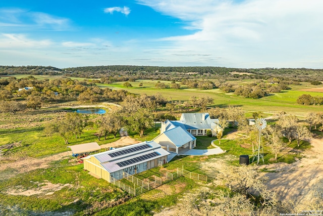 birds eye view of property with a rural view