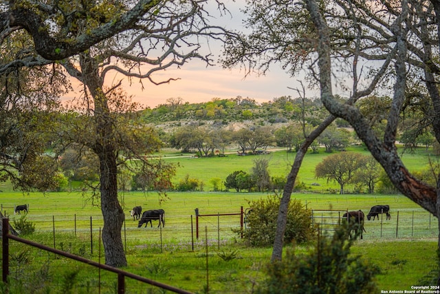 view of nearby features featuring a rural view and a yard