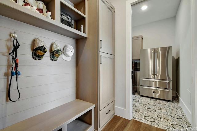 mudroom with light hardwood / wood-style floors