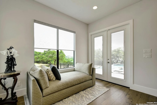 sitting room featuring hardwood / wood-style flooring and french doors