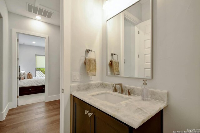 bathroom featuring vanity and hardwood / wood-style flooring