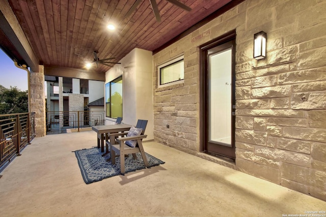 view of patio / terrace with ceiling fan and a balcony