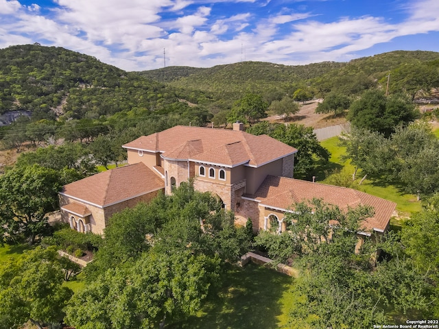 birds eye view of property featuring a mountain view