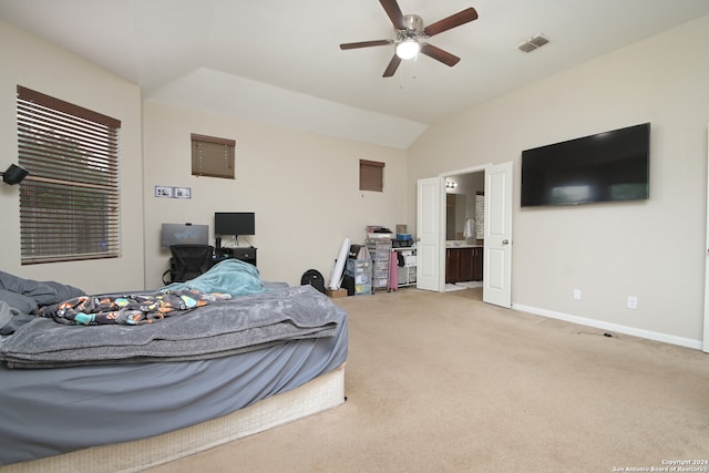 bedroom with ensuite bath, lofted ceiling, ceiling fan, and carpet