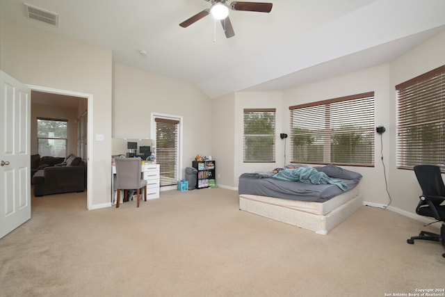 carpeted bedroom featuring vaulted ceiling and ceiling fan