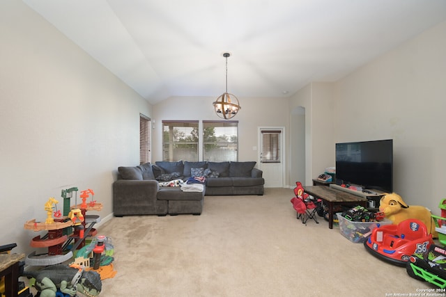 carpeted living room with vaulted ceiling and an inviting chandelier