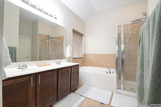 bathroom with large vanity, tile flooring, dual sinks, independent shower and bath, and lofted ceiling