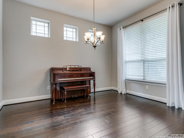 interior space with a chandelier and dark wood-type flooring