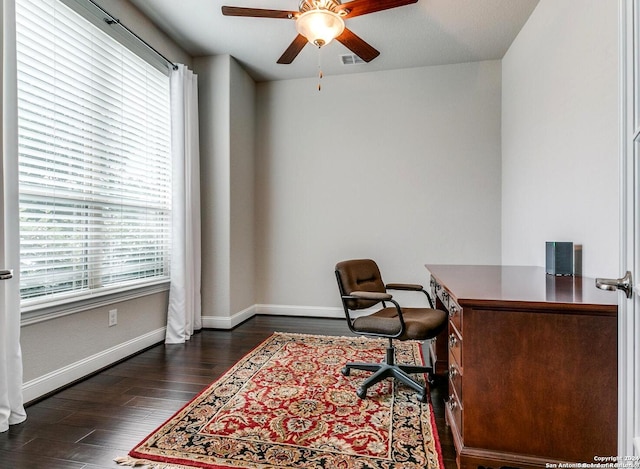 office space featuring ceiling fan and dark wood-type flooring