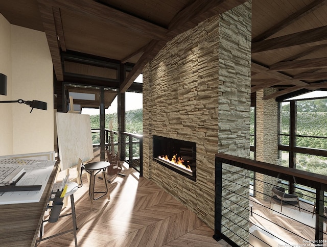 interior space with wood ceiling, a stone fireplace, and lofted ceiling with beams